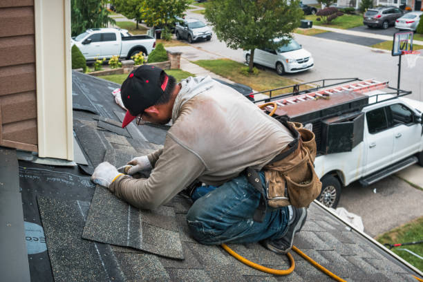 Professional Roofing technician working in East Bloomfield, NY